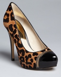 Win the style race in these cheetah-print MICHAEL Michael Kors platform pumps. Stylish cap toes are finished off with signature zipper accents.