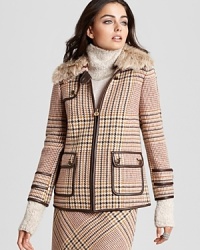 Exotics go elegant as a plush fur collar accents a plaid Tory Burch coat. Team with the coordinating Tory Burch pencil skirt for a refined walk on the wild side.