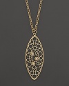 Faceted diamonds set in a 18K yellow gold pendant. By Roberto Coin.