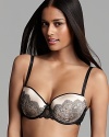 With a lace design woven into the cup, this chic Chantelle bra lies seamlessly under T-shirts and blouses. Style #1936.