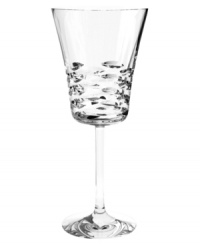 Classic technique, modern beauty. Crafted of fine Baccarat crystal, the Lola water glass pairs horizontal wedge cuts with a simply luminous base in a silhouette that radiates grace and sophistication.