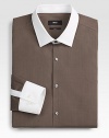 Not your basic solid dress shirt, this tailored classic of crisp, slim-fitting cotton, is accented with contrasting collar and cuff for a modern update.Button-frontPoint collarCottonMachine washImported