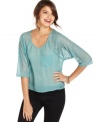 Dress to charm! Eyeshadow's three-quarter sleeve top features sheer lace and loads of feminine attitude.