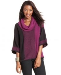 Almost like a plaid or patchwork, Style&co.'s cool tunic sweater uses colorblocking to create an altogether fresh look. Kimono sleeves and a cowl neckline give it a soft, appealing drape.