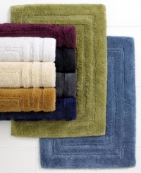 Treat your feet with these these plush bath rugs from Lauren Ralph Lauren, featuring ringspun cotton and viscose fiber from bamboo and a triple racetrack design. Choose from a variety of colors to complement any bath décor.