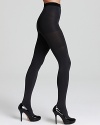 Two pairs of tights in one! Reversible tights that reveal a different color when turned inside out. Includes SPANX® slimming panels for a sleek silhouette. Style #005B