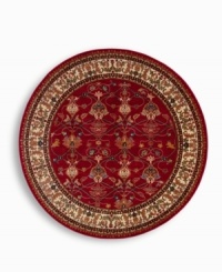 A larger-diameter round that is ideal for oversized rooms. In homage to renowned artist William Morris, this rug features his signature vine and pomegranate motifs framed by an acanthus leaf border inspired by a Morris & Co. tapestry. A special dyeing process imparts subtle shadings to a dynamic palette of blues, greens, terra cotta, saffron yellow and ivory tones on a warm red ground. The resulting striated effect recreates the depth of hue achieved by aged vegetable dyes. Woven of premium worsted wool and finished with a patented luster wash for indulgent softness.