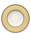 With a quaint floral garland and band of pale yellow in premium porcelain, this Audun rim soup bowl coordinates beautifully with the entire Audun country dinnerware collection from Villeroy & Boch.