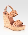 Rich leather style with an adjustable slingback, a natural cork wedge and braided leather straps. Cork wedge, 5 (125mm)Covered platform, 1½ (40mm)Compares to a 3½ heel (90mm)Leather upperLeather liningRubber soleImportedOUR FIT MODEL RECOMMENDS ordering one half size up as this style runs small. 