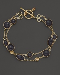 Two rows of soft grey enamel stations and diamond accents highlight this bracelet from Roberto Coin.