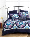 A vibrant and peppy palette melds with a deep navy hue in this Akala quilt for a totally fresh and modern flair. An eclectic mix of florals, circles and swirls finishes this unique design. Pair with coordinating shams and decorative pillows.