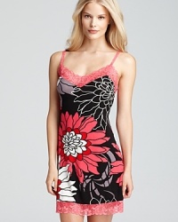 Send your dreams to an exotic place in this vibrant, floral-print chemise with pretty lace trim.