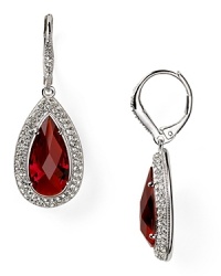 Regal ruby-colored stones illuminate these Nadri earrings, which flaunt an elegant allure, set off by rhodium plated metal.