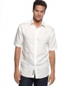 Dress up your everyday whites with this embroidered linen-blend shirt from Cubavera.