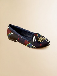 A stylish, comfortable flat is rendered in a colorful patchwork design and embellished with logo detail at the toe for a heritage look.Slip-onSynthetic patchwork upperLeather liningLeather soleImported