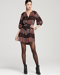 Make a mod statement with Aqua's shirt dress in a bold geometric print. Team with edgy ankle boots for city chic.