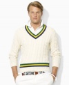 Accented with preppy stripes for an athletic-inspired finish, a classic cricket sweater is cable-knit from plush Pima cotton yarns for an ultra-soft hand.