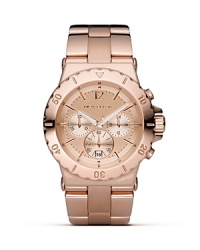 MICHAEL Michael Kors is right on time with the rose gold-plated chronograph. Featuring a three eye design, round dial and bracelet strap.