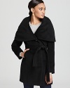 This hooded Elie Tahari wool-blend coat brings soft sophisticated to your schedule, perfect for workdays and weekends alike. A concealed front placket is polished, while one visible button at the neckline lends a chic pop of style.