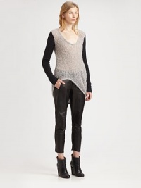 Contrasting sleeves and an asymmetrical hi-lo hem add urban charm to this uniquely textured boucle sweater. ScoopneckLong sleevesAsymmetrical hi-lo hemBack hem hits below the hips30% alpaca/30% mohair/24% viscose/16% nylonDry cleanImported of Italian fabricModel shown is 5'10 (177cm) wearing US size Small.