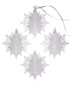 Shimmer and shine. Add a look of winter wonderment to your tree with this set of four snowflake ornaments embellished with silver sparkles for a luminous quality.