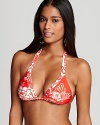 A beautiful floral print defines this brilliantly colored Nanette Lepore bikini top-it will lighten up your weekend bag since it reverses to a floral-on-white print for a bit of beachy variety.