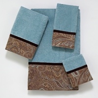 Luxurious velour decorative towel is embellished with a woven classic paisley border design in browns and blues. The border is finished off with a coordinating brown velvet ribbon.