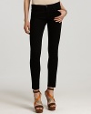 J Brand's skinny black jeans are a must-have for seasonless super-sleek style. Tonal stitching and antique black hardware keep the look inky and with coordinating silk top and pumps, the single-hued effect is simply sexy.