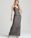 In showstopping sequins, Adrianna Papell's dazzling long dress lends timeless glamour.