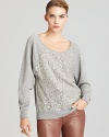 Glimmering silver sequins add fun and festivity to this striking French Connection sweater--dazzle your denim!