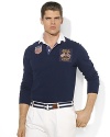 A handsome rugby shirt is cut for a trim, modern fit with athletic details and bold flag patches, celebrating Team USA's participation in the 2012 Olympic Games.