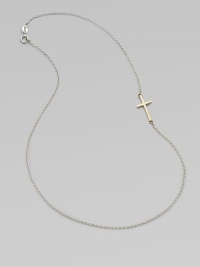 A simple, sleek cross of 14k gold sits sideways within a delicate sterling silver chain in this eloquent design.14k yellow gold and sterling silverLength, about 18Spring ring claspMade in USA