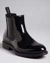 In shiny rubber and classic slip-on style, this BOSS rain boot brightens the cloudiest day.