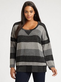 A glamorous take on an athletic style, this striped top is enhanced by pretty metallic thread. Its relaxed-yet-feminine silhouette will complement your shape.Round neckLong sleevesPull-on styleAbout 26 from shoulder to hemRayon/lurexMachine washMade in USA