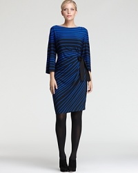 The graphic jolt of variegated stripes lends serious fashion presence to a Taylor Dresses Plus sheath dress, cinched with a tie belt for feminine impact.