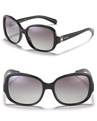 Sophisticated oblong oversized sunglasses with signature logo plate at temples from Prada.