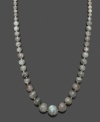 Polish your look in neutral tones. This versatile necklace features graduated, labradorite beads (6-16 mm) and a 14k gold clasp. Approximate length: 18 inches.