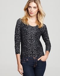 An exotic, trend-on animal print enriches this stylish knit John + Jenn sweater.