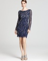 Elaborate beading lends evening sparkle to Aidan Mattox's embellished dress, rich in sophisticated glamour.