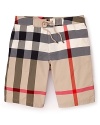 In an allover check print, these iconic swim trunks from Burberry take classic style to the seaside.