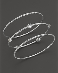 A trio of glimmering bangles makes the perfect gift set. Includes two solid bangles and one jeweled. From Ippolita.