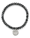 A signature showpiece from Michael Kors, this hematite stone bracelet is detailed with a silver plated charm and stretches for a perfect fit.