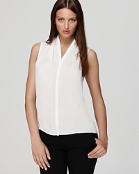 As easy an a tee, but infinitely more chic, this sleeveless VINCE CAMUTO blouse slips into pencil skirts just as well as boyfriend jeans. The styling possibilities are endless.