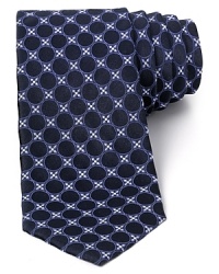 The negative space of the circle pattern creates an alluring three-dimensional effect on this lavish silk tie from Valentino, a unique addition to your refined collection.