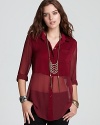 In a flavorful berry hue, this Free People shirt updates the classic button-down style with sheer accents and a back slit for an ultra-feminine look.