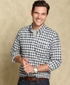 Classic pattern meets modern cool with this gingham check slim-fit shirt from Tommy Hilfiger. (Clearance)