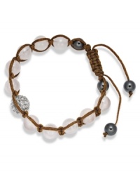 Spiritual-inspired bracelets are all the rage this season! Snap up this hot style from Ali Khan featuring semi-precious rose quartz beads and pave glass fireballs on a trendy brown cord. Bracelet adjusts to fit the wrist. Approximate diameter: 2 inches. Approximate length: 12-1/4 inches.