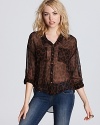 Tap into your sheer animal instincts with this perfectly on-trend Free People top.