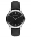 This Burberry timepiece features a black leather strap and round stainless steel case with sapphire crystal. Textured black dial with smooth sunray inner dial features silver tone stick indices, two hands and logo. Swiss quartz movement. Water resistant to 30 meters. Two-year limited warranty.