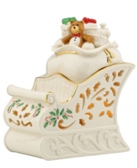 With an inner glow, pierced detail and a holly motif to match the beloved Holiday pattern, this porcelain sleigh figurine from Lenox captures the childlike joy of the season.